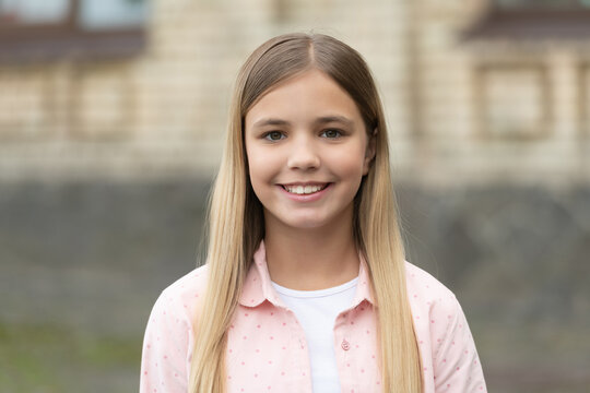 Portrait of happy kid with smiling face outdoors