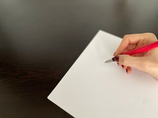 hand with pen and paper