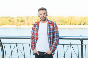 male fashion model. education online. listening audio book. handsome man