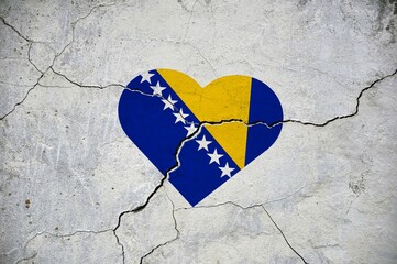 The symbol of the national flag of Bosnia and Herzegovina in the form of a heart on a cracked...