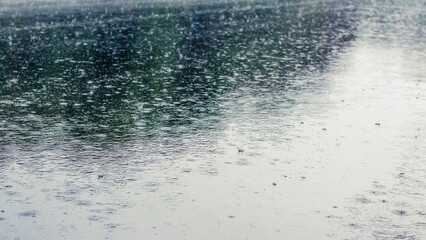 Plakat River in the rain. Water surface during a downpour
