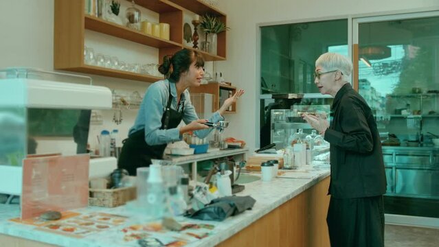 Angry customer complaining about barista in coffee shop