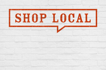 Obraz premium SHOP LOCALの文字と吹き出しが書かれたレンガ壁