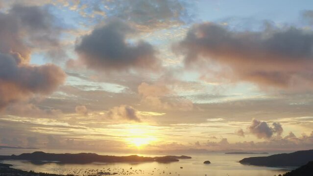 aerial view bright sunrise above Chalong sea Phuket..beautiful cloud over archipelago..lens flare background.  4k stock footage video.