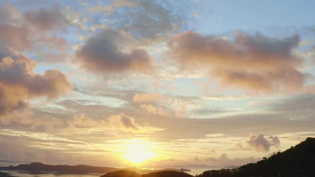 aerial view bright sunrise above Chalong sea Phuket..beautiful cloud over archipelago..lens flare background.  4k stock footage video.