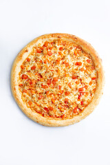 Big pizza with red pepper and cheese on a white plate.