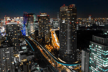 Obraz na płótnie Canvas Long exposure photo of the skyline of Tokyo at night.