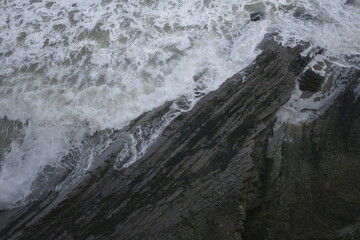 Wave breaking against the cliffs