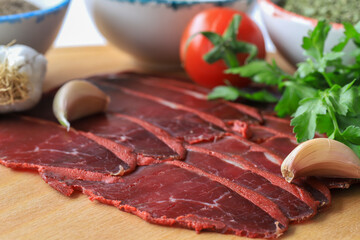 Turkish pastrami. sliced bacon. Pastrami is made from the ribeye and beef tenderloin parts of the cow. local name kayseri pastrami