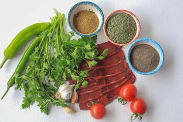 Turkish pastrami. sliced bacon. Pastrami is made from the ribeye and beef tenderloin parts of the cow. local name kayseri pastrami