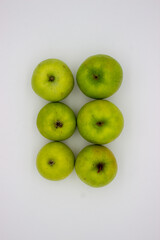 Few green apples on white background
