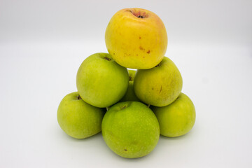 Few green apples on white background