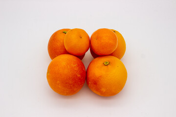 Few oranges on white background