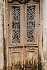 Old ancient door with forged iron details in historical part in the old town of Tbilisi, capital city of Georgia. Architecture.