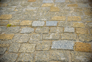 Cobblestone street texture. Regular shapes of cobblestone road, abstract background of old cobblestone pavement close-up
