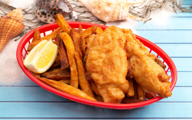 Fish and Chips on a Blue Wood Table a Classic Meal
