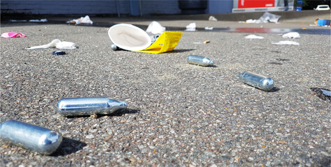 Nitrous oxide patrons used for laughing gas as a drug in Denmark and dumped in the streets - obrazy, fototapety, plakaty