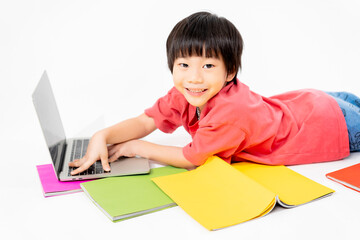 Portrait of Happy asian boy on floor with laptop and books isolated on white background, Education and learning with technology concept