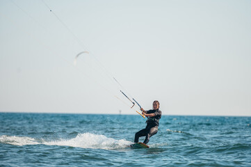 Woman kitesurfing on the ocean waters