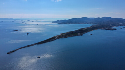 Aerial drone photo of iconic peninsula of Kinosoura or dog's tail in industrial part of island of Salamina, Saronic gulf, Greece