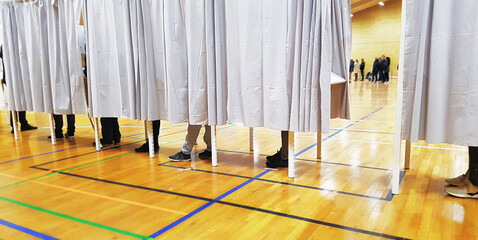 People at a Danish polling station on election night giving their anonymous votes for a political...