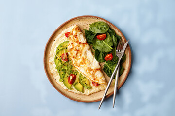 Omelette. Healthy Omelet. Vegetarian. Avocado andmicrogreens, tomatoes and spinach