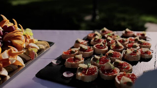 red caviar canape on the festive table of appetizers