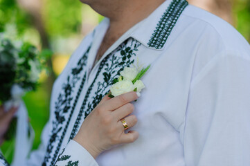 Boutonniere on the groom's jacket