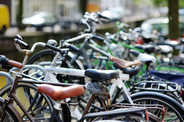 Fototapeta na wymiar Many bicycles parked on the street of Amsterdam, Netherlands.