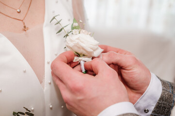 Boutonniere on the groom's jacket