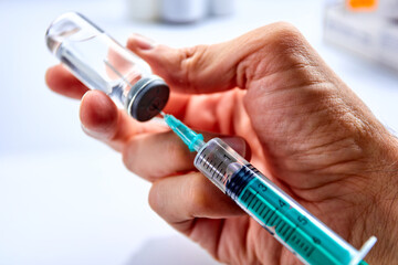  Vaccine in vial with syringe