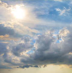 Fototapeta na wymiar dramatic cloudy sky with sparkle sun, natural sunny sky background