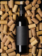 A bottle of red wine lies on the corks. Many objects. Restaurant, hotel, bar, winemaking, wine cellar. Holiday, supermarket, advertising business, banner.