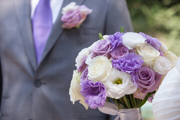 wedding bouquet of purple and white flowers