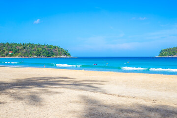 Beautiful sandy beach in Thailand with white sand and blue water, tropical vegetation. Travel and tourism
