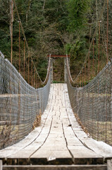 Old suspension bridge in the middle of the mountain