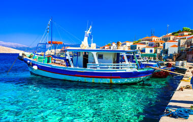 Traditional Greece fishing villages - charming colorful Chalki (Halki) island in Dodecanese. view with typical boats