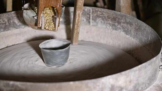Old mill for grinding grain made of stones and wood