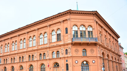 Riga, Latvia - Riga Bourse Art Museum on Cathedral Square, Neo-classical, orange building in Riga,...