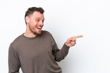 Young Brazilian man isolated on white background pointing finger to the side and presenting a product
