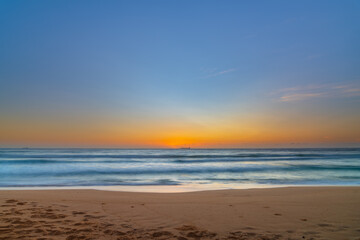 Fototapeta na wymiar Sun, sand, ship sunrise seascape