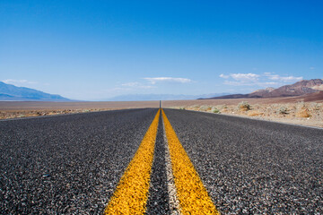 Fototapeta na wymiar Endless road through the Death Valley