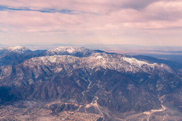Fototapeta na wymiar Aerial view of the San Gabriel Mountains outside of Los Angeles featuring Mt Baldy and Mt San Antonio's