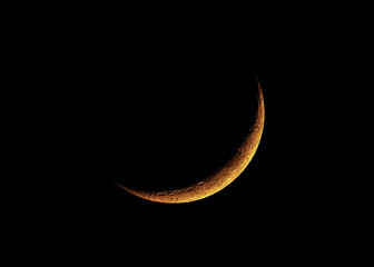 Obraz na płótnie Canvas The Waxing Crescent Moon at 17% view on a warm spring night is a spectacular sight to see