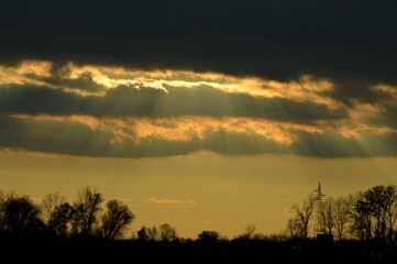 the sunset is orange and the rays of the sun