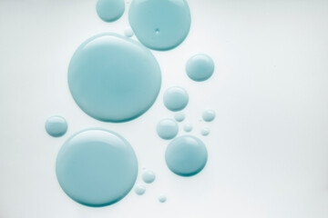 Cosmetic liquid serum or acid peeling or blue hyaluronic acid gel textured background swatch isolated background