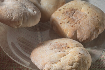 Syrian bread on a dish with copy space left and natural light