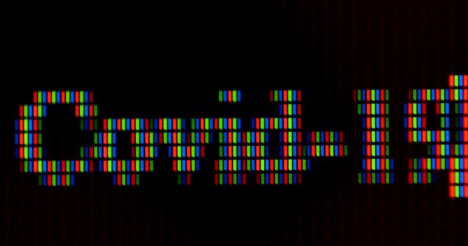 The inscription in letters covid 19 on the monitor display. Cursor movement. Dark background. Pixel style.