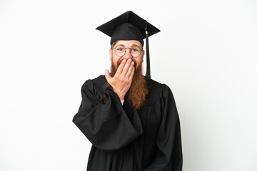 Young university graduate reddish man isolated on white background happy and smiling covering mouth with hand