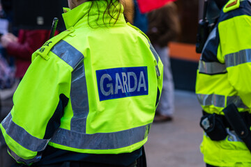 Garda inscription on jacket of policeman